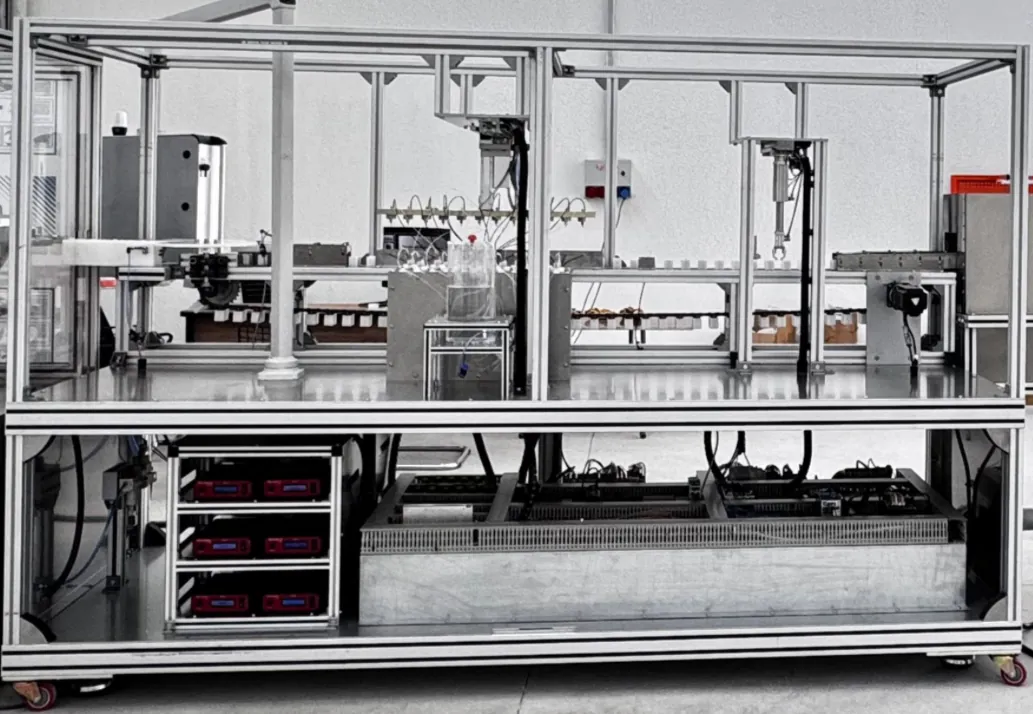 Blood gas collection tubes being coated with heparin by MicroSpray 120 kHz ultrasonic nozzles on a production coating system